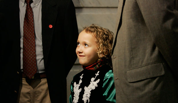 Seven-year-old Amber Harland-Bennett listens as her adoptive parents, Richard and Anthony Harland-Bennett, speak with reporters during a rally in Frankfort, Kentucky, in February 2009. (AP/Ed Reinke)