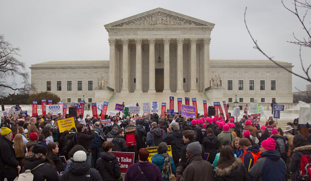A crowd gathers outside the Supreme Court on March 4, 2015, as the Court hears arguments in <i>King v. Burwell</i>. (AP/Pablo Martinez Monsivais)