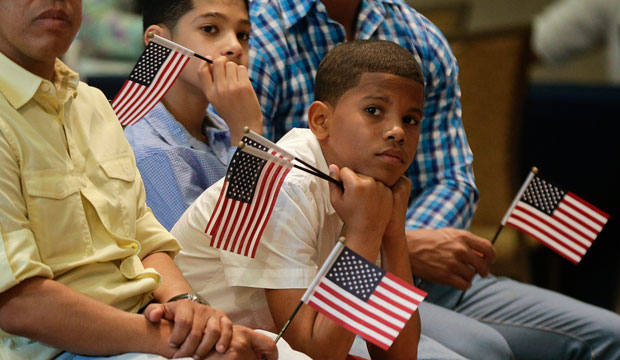 Derek Martinez listens during a citizenship ceremony in New York on May 26, 2015. (AP/Julie Jacobson)