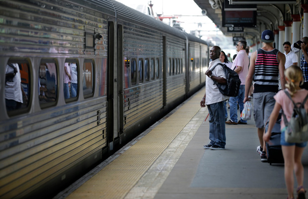 People wait to board a train to New York City at the Trenton train station in Trenton, New Jersey, July 2014. (AP/Mel Evans)