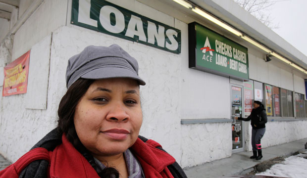 On January 22, 2015, Maranda Brooks stands outside a payday loans business that she frequented in the past in Cleveland, Ohio. (AP/Tony Dejak)