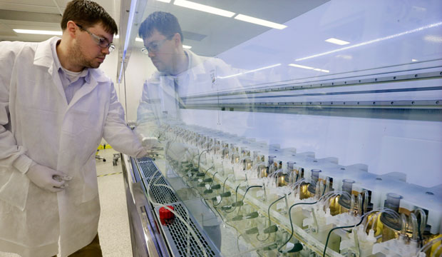 Scientist Christopher Kistler checks on experiments at a laboratory in Kenilworth, New Jersey. (AP/Mel Evans)