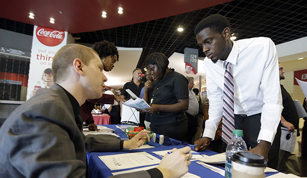 A jobseeker listens to an employer during a job fair in Sunrise, Florida, June 2015. (AP/Alan Diaz)