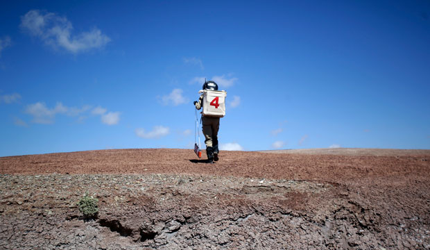 A geologist hikes up a hill near the Mars Desert Research Station in Hanksville, Utah, April 19, 2015. (AP/Rick Bowmer)