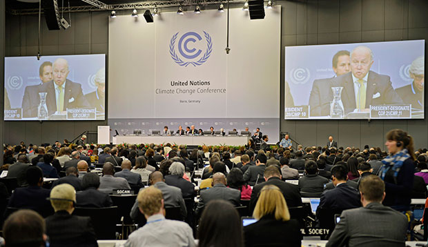 French Foreign Minister Laurent Fabius talks to delegates during the U.N. Framework Convention on Climate Change in Bonn, Germany, June 1, 2015. (AP/Martin Meissner)