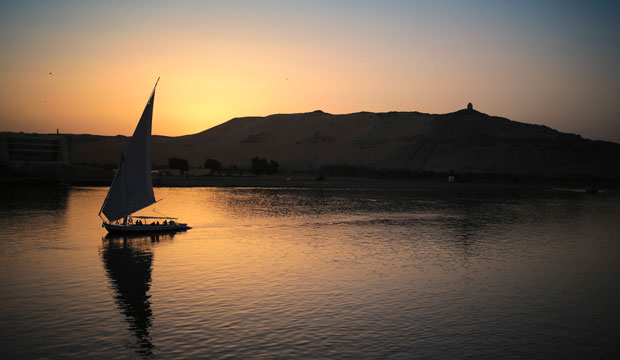 A boat carrying tourists and locals sails in the Nile River at sunset in Aswan, Egypt, April 2015. (AP/Mosa'ab Elshamy)