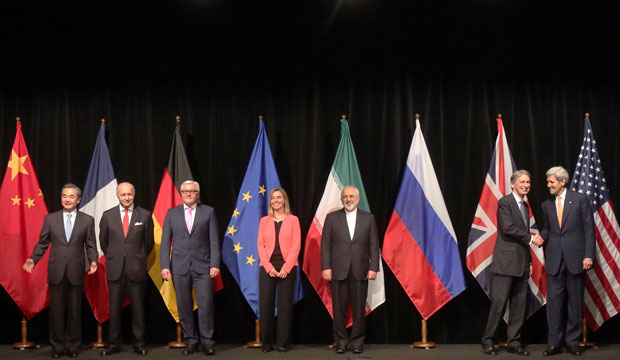 Negotiators pose for a group photo following talks with Iran on its nuclear program in Vienna, Austria, on July 14, 2015. (AP/Ronald Zak)