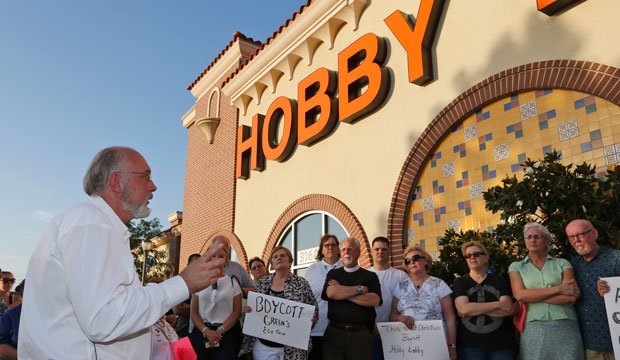 Rev. Bruce Prescott speaks during a vigil outside a Hobby Lobby store in Edmond, Oklahoma, on June 30, 2014, in opposition to the U.S. Supreme Court's <i>Burwell v. Hobby Lobby</i> decision. (AP/Sue Ogrocki)