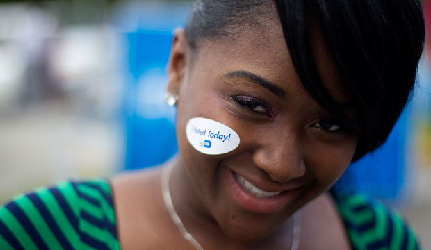 A young voter wears her 