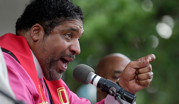 Rev. William Barber speaks to a crowd at a rally in Winston-Salem, North Carolina, on July 13, 2015, after the beginning of a federal voting rights trial. (AP/Chuck Burton)