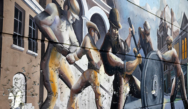 A mural dedicated to the history of the Pullman railcar company is shown in the Pullman neighborhood of Chicago, August 22, 2014. (AP/Charles Rex Arbogast)