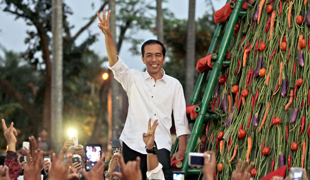 Indonesian then-President-elect Joko Widodo greets supporters during a gathering in Jakarta, Indonesia, on July 23, 2014. (AP/Dita Alangkara)