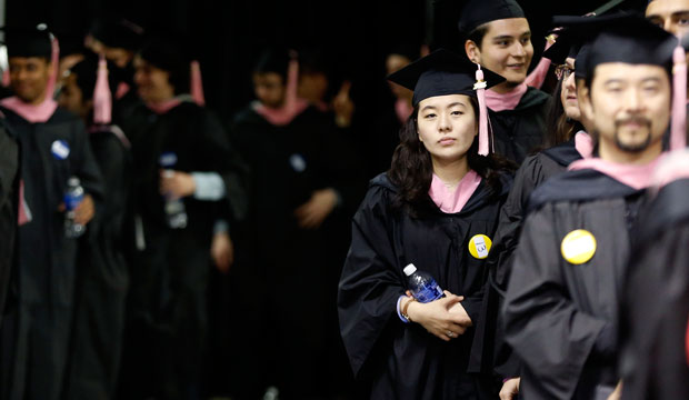 Graduates line up before commencement ceremonies. (AP/Michael Dwyer)