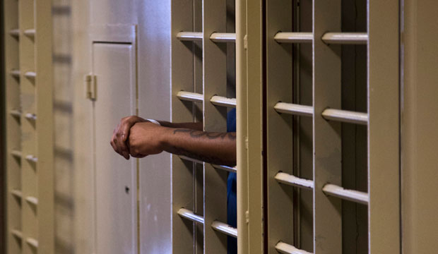 A prisoner stands in an isolation cell in the Dane County Jail in Madison, Wisconsin, on September 16, 2014. (AP/Morry Gash)