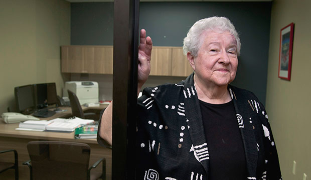 An elderly employee poses for a photo at her workplace in Lincoln, Nebraska, August 2012. (AP/Nati Harnik)