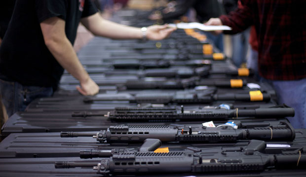 A row of weapons is seen at a gun show, March 2008. (AP/Casey Templeton)