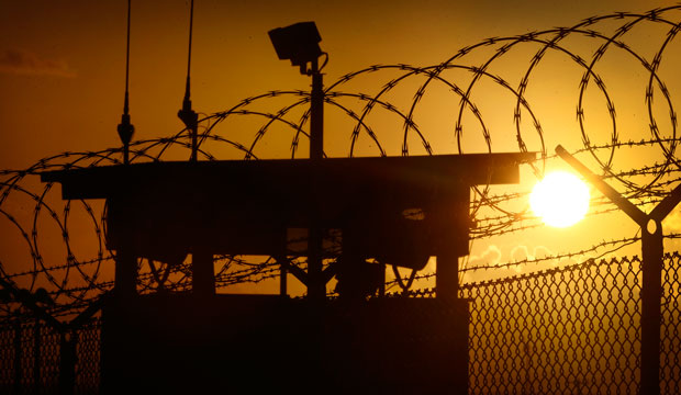 The sun rises above Camp Delta at Guantanamo Bay Naval Base, Cuba, on November 20, 2013. (AP/Charles Dharapak)