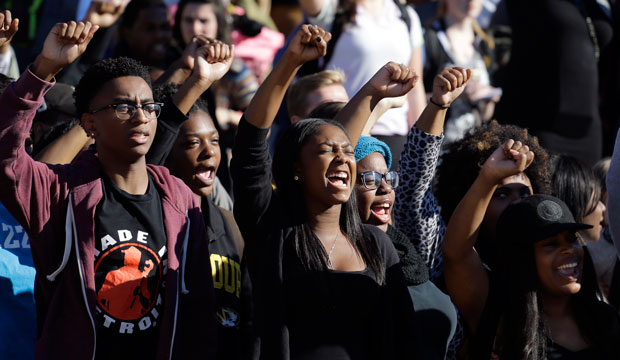 Students cheer following the resignation of University of Missouri system President Tim Wolfe in Columbia, Missouri, on November 9, 2015. (AP/Jeff Roberson)