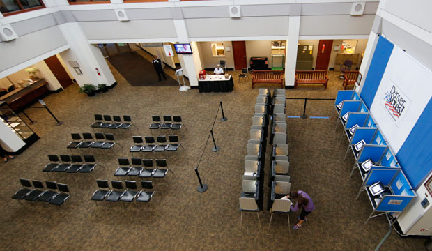 A lone voter casts a ballot during the statewide general election, November 3, 2015, in Denver. (AP/David Zalubowski)