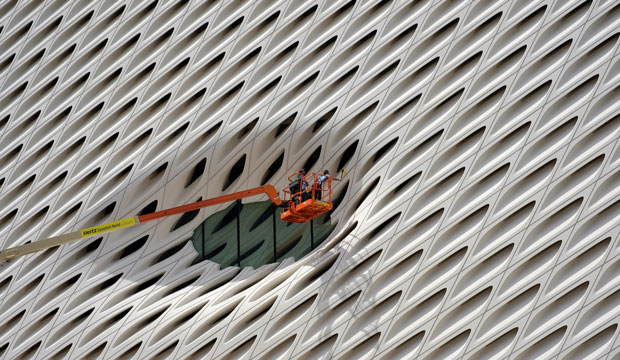 Workers clean the facade of the Broad Museum in downtown Los Angeles on September 1, 2015. (AP/Richard Vogel)