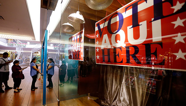 Voters wait in line at a polling place located inside a shopping mall on Election Day, in Austin, Texas, November 6, 2012. (AP/Eric Gay)