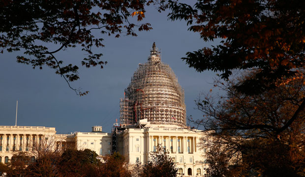 The U.S. Capitol dome is seen under repair on Capitol Hill, Sunday, November 22, 2015 in Washington. (AP/Alex Brandon)
