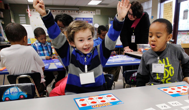 A kindergarten student celebrates winning a game at Campbell Hill Elementary in Renton, Washington, on February 6, 2013. (AP/Elaine Thompson)