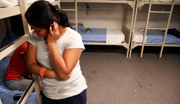 An unidentified Guatemalan woman stands inside a dormitory in the Artesia Family Residential Center on September 10, 2014. (AP/Juan Carlos Llorca)