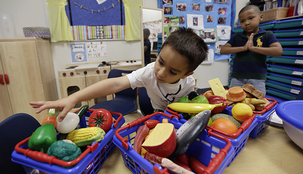 Pre-K students enjoy educational toys at an education center in Texas, April 2014. (AP/Eric Gay)