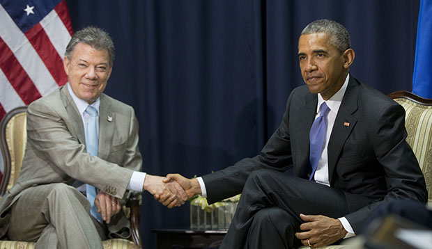 U.S. President Barack Obama, right, shakes hands with Colombian President Juan Manuel Santos, left, during their bilateral meeting at the Summit of the Americas in Panama City, Panama, April 11, 2015. (AP/Pablo Martinez Monsivais)