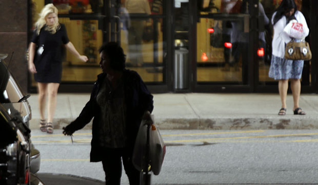 Shoppers leave a store in Salem, New Hampshire, September 2012. (AP/Elise Amendola)