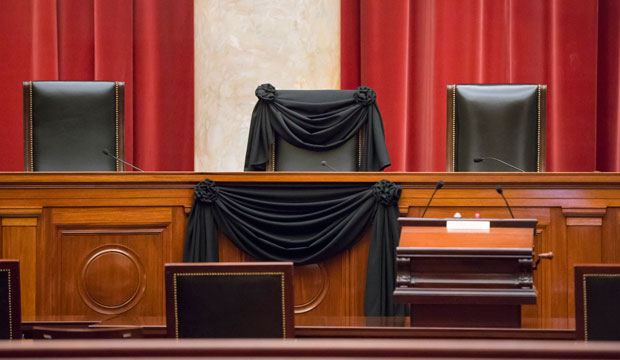 In this February 16, 2016, photo, Supreme Court Justice Antonin Scalia’s courtroom chair is draped in black to mark his death at the U.S. Supreme Court in Washington. (AP/J. Scott Applewhite)