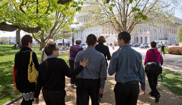 LGBT rights activists lobby senators on immigration bills in order to allow same-sex couples to sponsor visas for their partners in April 2013. (AP/Carolyn Kaster)