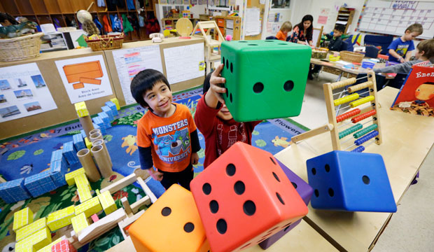 Children play at the Creative Kids Learning Center, a school that focuses on pre-kindergarten for 4- and 5-year-olds, in Seattle, Washington, on February 12, 2016. (AP/Elaine Thompson)