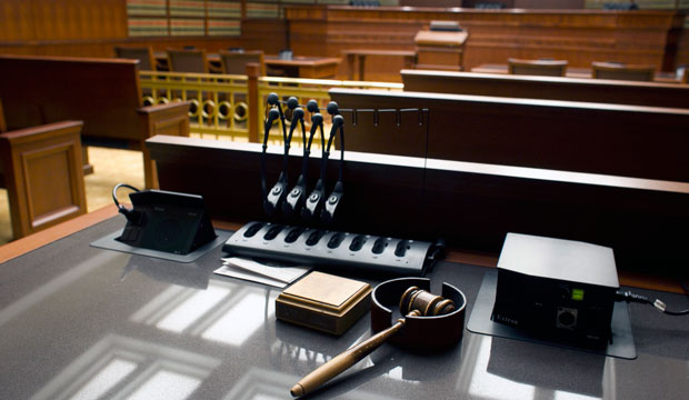 A gavel sits on a desk inside a courtroom. (AP/Brennan Linsley)