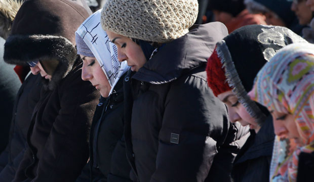 Muslim women pray outside the White House on February 13, 2015, after the murder of three young North Carolina Muslims. (AP/Jacquelyn Martin)