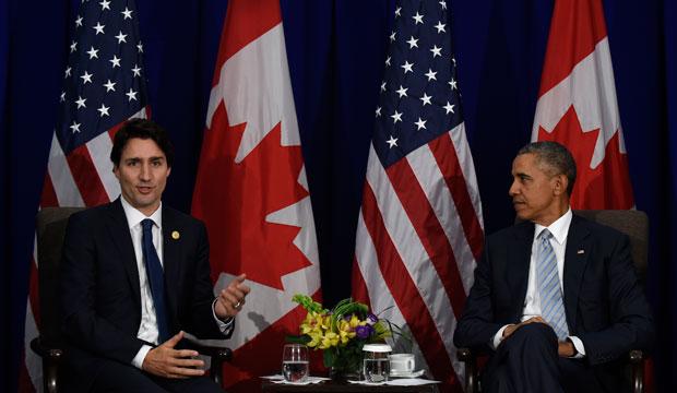 President Barack Obama, right, listens as Canada’s Prime Minister Justin Trudeau, left, speaks at the Asia-Pacific Economic Cooperation summit in Manila, Philippines, November 19, 2015. (AP/Susan Walsh)