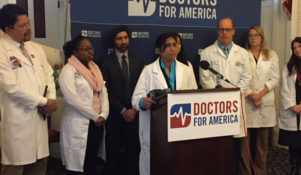 Doctors for America presents a petition at a press conference on December 2, 2015, in Washington, D.C. (ThinkProgress/Alex Zielinski)