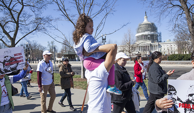 Immigration activists demonstrate at the Supreme Court in Washington in support of President Barack Obama's executive order to grant relief from deportation in order to keep immigrant families together, March 18, 2016. The U.S. Capitol is in the background. (AP/J. Scott Applewhite)