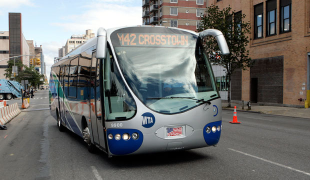New York City's Metropolitan Transit Authority tests a new 35-foot-long electric hybrid bus, which runs along 42nd Street in New York City, on October 12, 2007. (AP/David Karp)