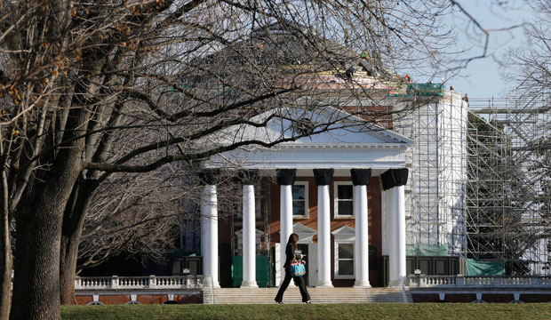 A student walks across the lawn in front of the Rotunda at the University of Virginia in Charlottesville, Virginia, on February 20, 2013. (AP/Steve Helber)