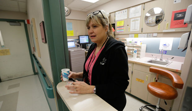 A nurse prepares to hand out medicine to patients at a hospital in Washington state on November 18, 2015. (AP/Ted S. Warren)