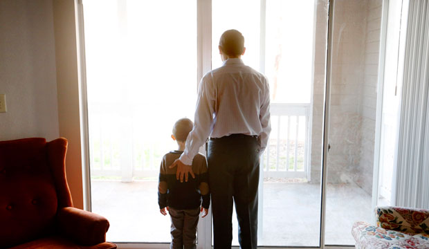 Mohammad, a Syrian refugee, poses for a photo with his son in their home in Marietta, Georgia, on January 5, 2016. (AP/David Goldman)