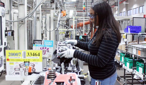 Alana Sutton works on an engine at a Harley-Davidson plant in Menomonee Falls, Wisconsin, on November 20, 2014. The company is targeting women to help fill manufacturing jobs. (AP/Carrie Antlfinger)