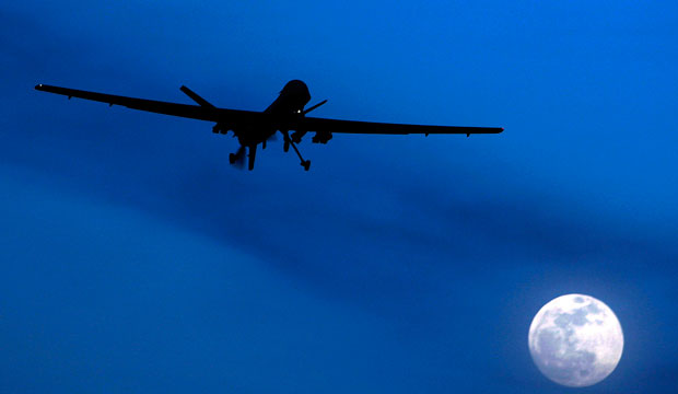An unmanned U.S. Predator drone flies on a moon-lit night, January 2010. (AP/Kirsty Wigglesworth)
