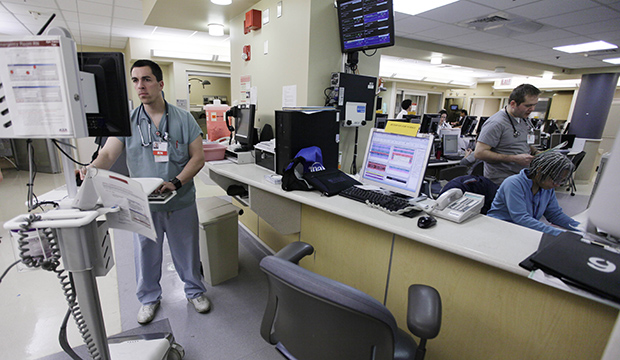 Nurses at the University of Chicago Medical Center in Chicago work in the emergency room at the hospital, November 2010. (AP/M. Spencer Green)