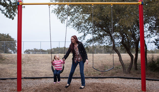 A woman plays with her 3-year-old daughter in Lakeway, Texas, in January 2014. (AP/Tamir Kalifa)