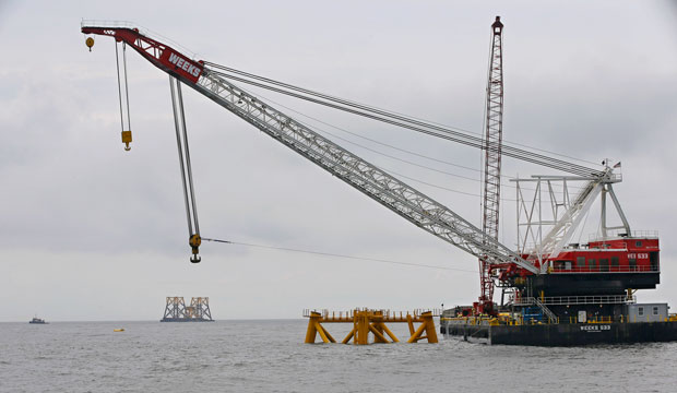 The first wind turbine foundation jacket for the Block Island Wind Farm—the United States’ first commercial offshore wind facility—is seen offshore of Rhode Island in July 2015. (AP/Stephan Savoia)