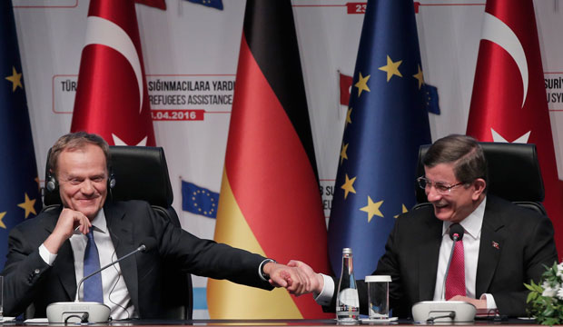 Turkish Prime Minister Ahmet Davutoğlu shakes hands with European Council President Donald Tusk during a joint news conference in Gaziantep, Turkey, on April 23, 2016. (AP/Lefteris Pitarakis)