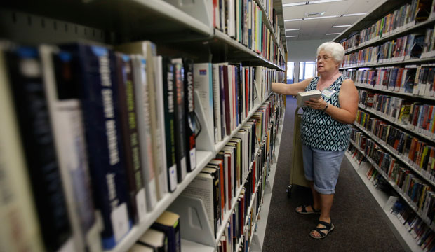 Shonna Bennett volunteers at a branch of the Citrus County Library in Beverly Hills, Florida, on September 10, 2014. (AP/John Raoux)